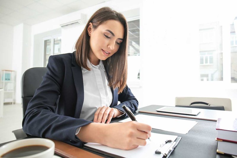 Woman Signing Law Documents